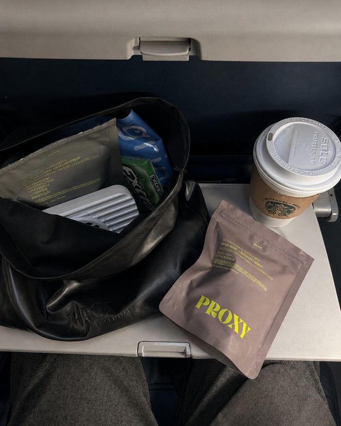 Proxy pouch on an airplane tray table