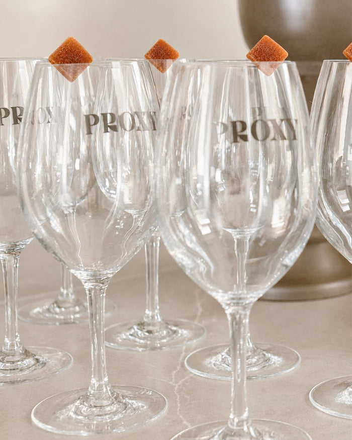 Gummies on the rims of PROXY wine glasses